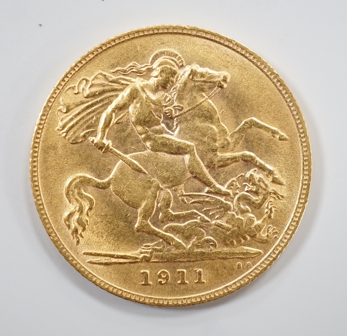 A George V 1911 gold half sovereign.